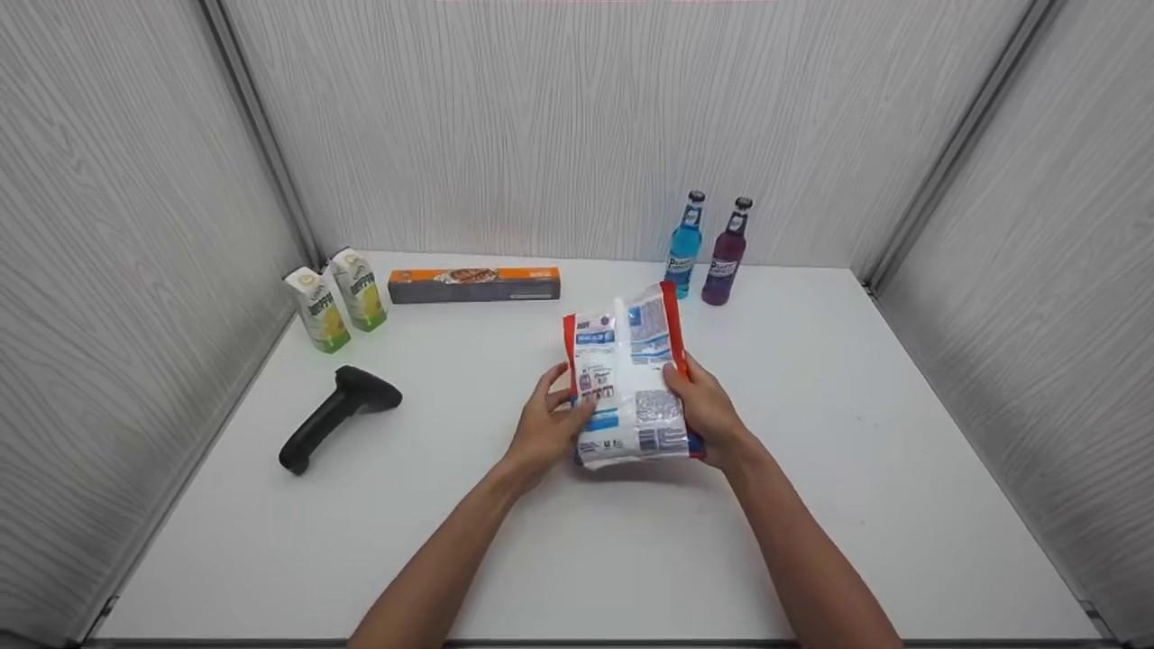 Egocentric demonstration turning over a bag of laundry powder